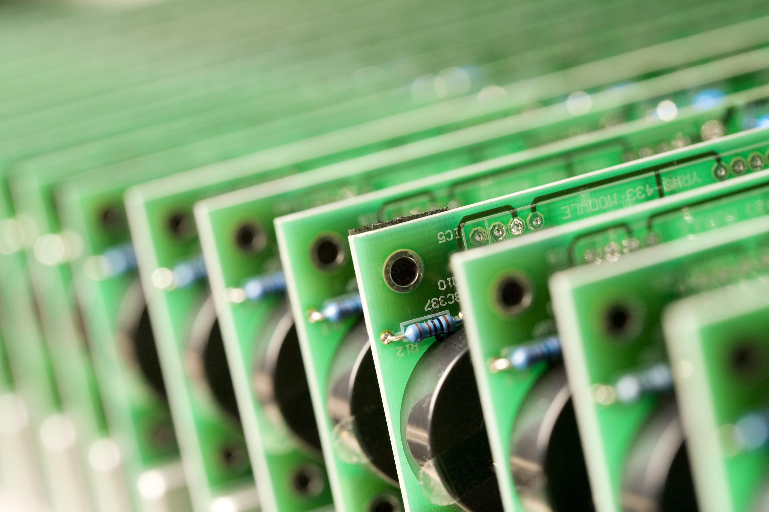 Electronic circuit boards lined up. Paul Scott, industry.